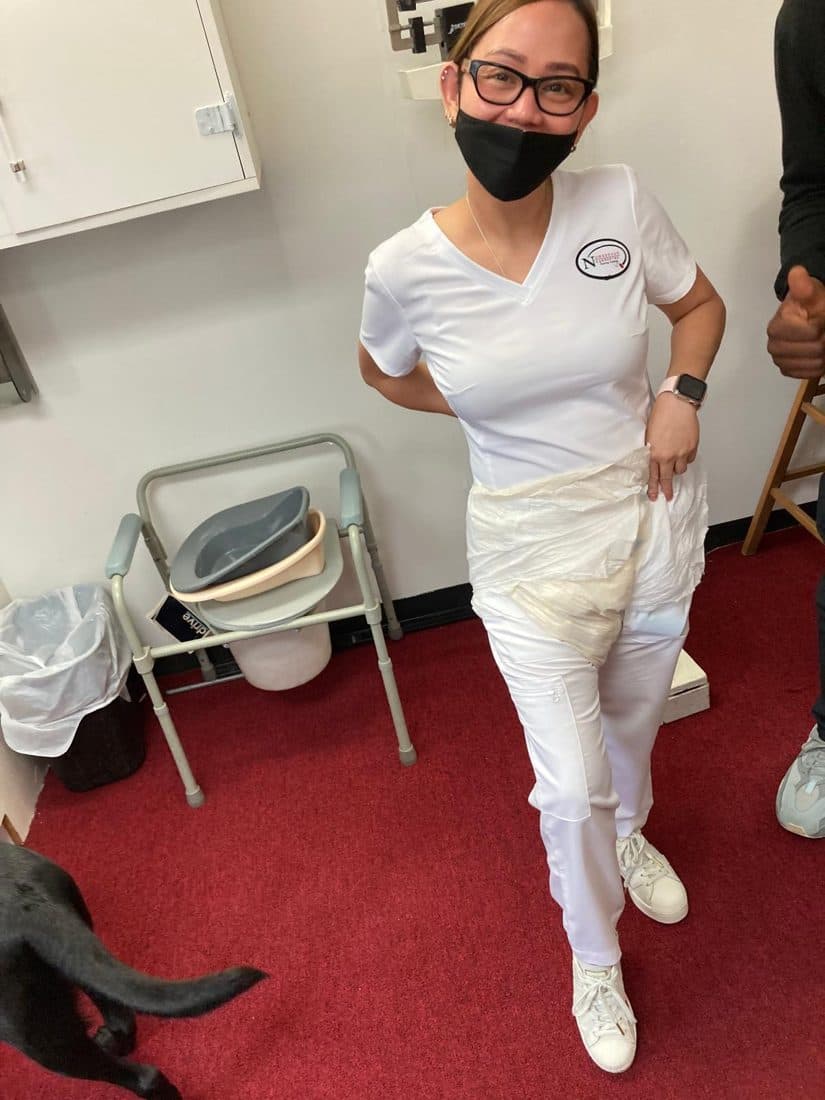Student in scrubs during hands-on clinical training